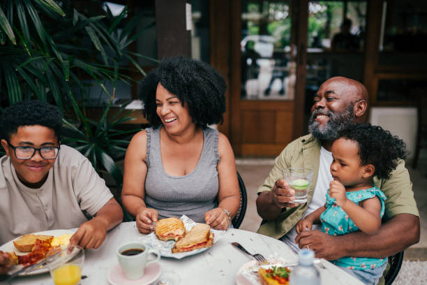 istock Family with kids having a lunch in a restaurant 1991161838