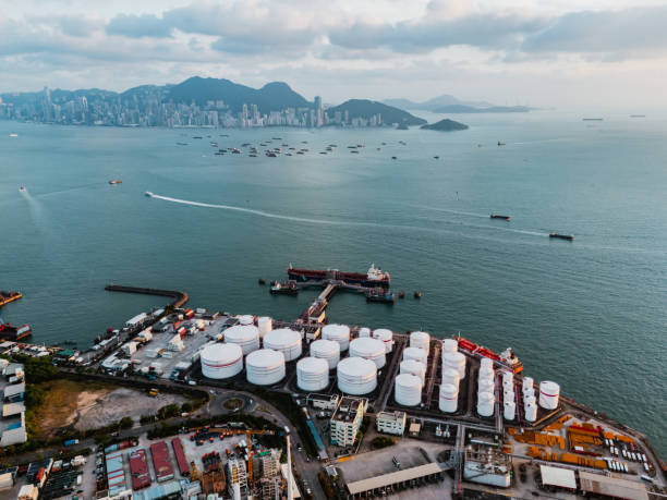 istock Tank ship loading unloading oil and gasoline at Commercial dock in sea 1991182833
