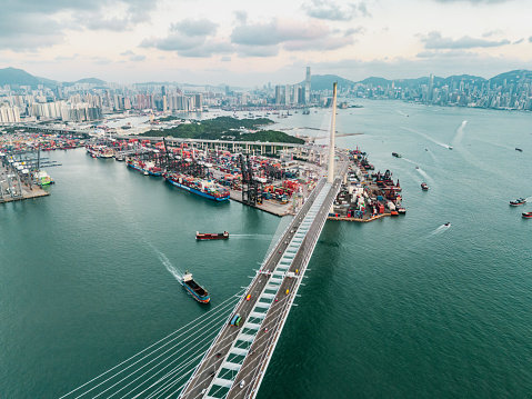 Drone view of Stonecutters Bridge and the Tsing sha highway at sunset