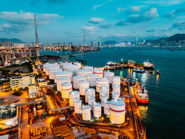 istock Tank ship loading unloading oil and gasoline at Commercial dock in sea 1991182858