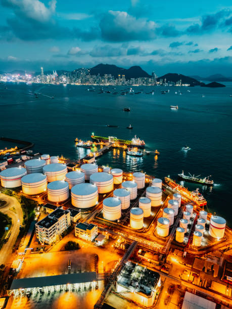 istock Tank ship loading unloading oil and gasoline at Commercial dock in sea 1991182876