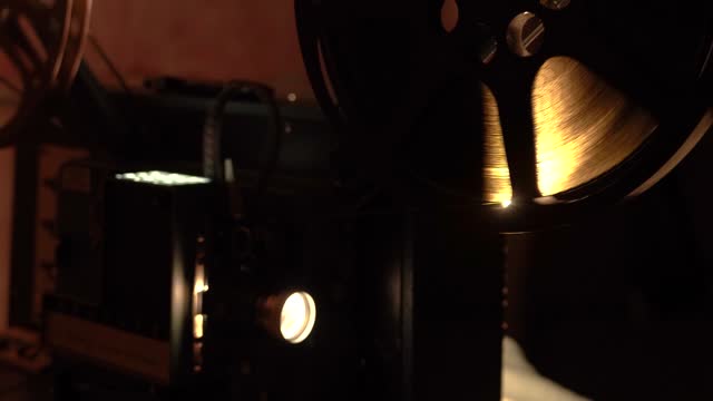 Retro vintage movie projector on a dark background