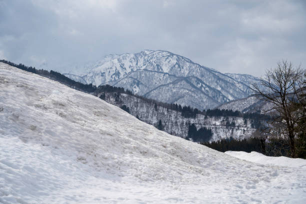 Shirakawago surrounded by snowy mountains