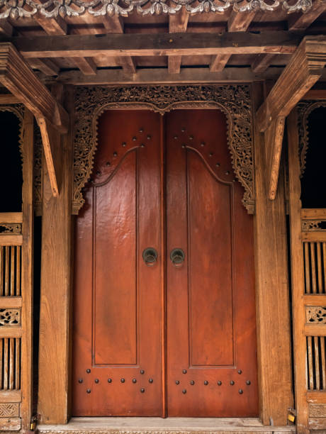 istock Doors made of wood in traditional Javanese style 1991327175