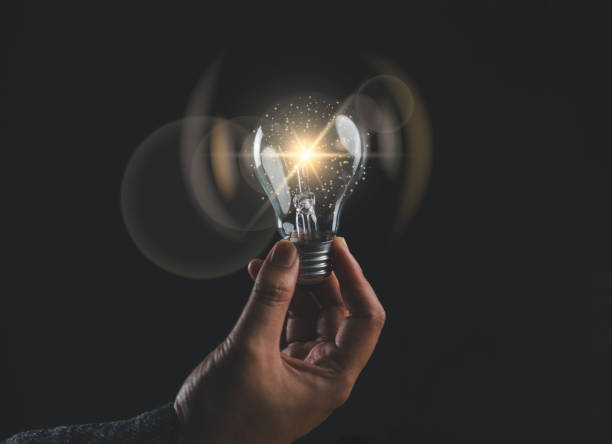 istock Businessman touching a bright light bulb. Concept of Ideas for presenting new ideas Great inspiration and innovation new beginning. 1991357767