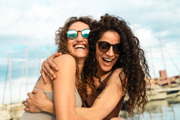 Close Friends Hugging and Laughing on Yacht