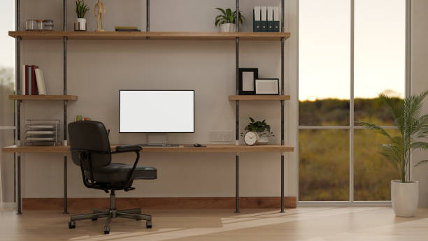 istock Interior design of a modern, minimalist home office workspace with a computer mockup on a table 1991448823