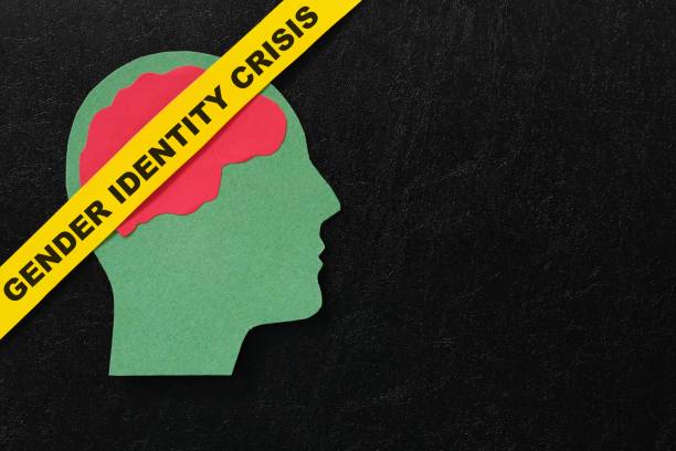 istock Human head profile with word gender identity crisis in dark black background. 1991470923