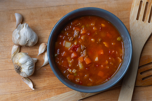 Homemade vegetable beef soup with a pinch of garlic.