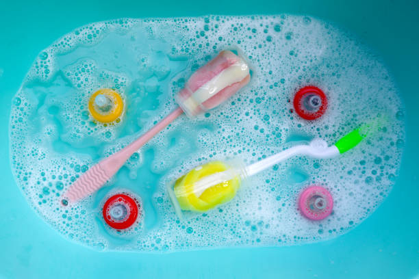 istock Wash baby bottles in plastic blue basin 1991824157