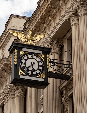 London, England, UK June 2019 - Clock outside the Daiwa Capital Markets investment bank in King William Street in London's Square Mile Financial District.  The buildings architect was Richard Rogers and Partners and was completed in 2005.