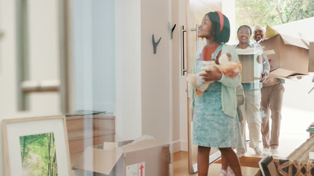 Children, parents and front door at new home for moving, boxes and excited for fresh start with property. Mother, father and kids with smile, toys and luggage for real estate, investment or mortgage