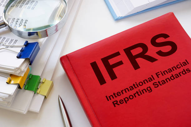 istock A stack of papers and a book IFRS International Financial Reporting Standards. 1991861786