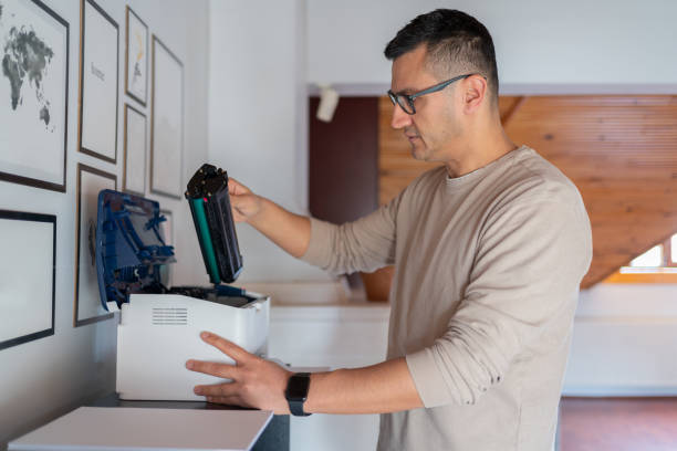 istock Man Change The Printer Toner At Home 1991881842