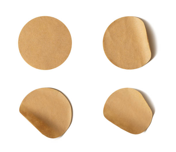 istock Brown paper round stickers with peeling corner 1991889752