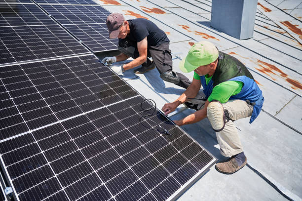 istock Workers building solar panel system on roof of house. Men installing photovoltaic solar module 1991889784