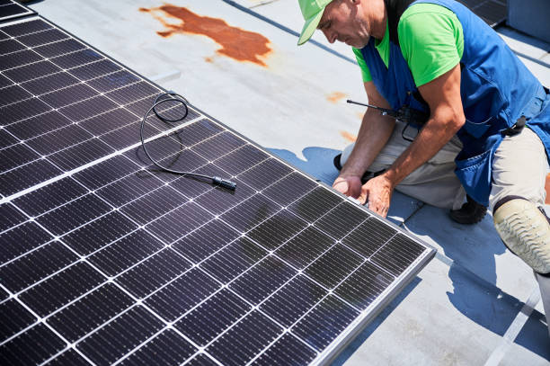 istock Workers building solar panel system on roof of house. Men installing photovoltaic solar module 1991890250