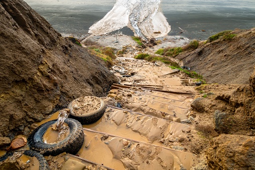 Muddy Eroded Hiking Path Down Sandstone Cliffs at Torrey Pines State Park after Historic Atmospheric Rain Storm Floods in San Diego, Southern California, USA