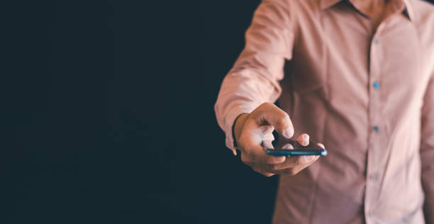 istock The man's hand is using the mobile phone 1991907258