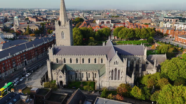 Aerial view of cathedral and park from Saint Patrick's Park-Dublin, Aerial view of historic St. Patrick's Cathedral in the heart of Ireland, Christ Church Cathedral, Aerial view of people walking in saint Patrick park, Public park fountain