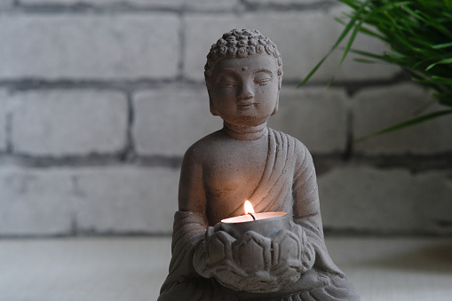small stone statue of buddha decorative candle stand