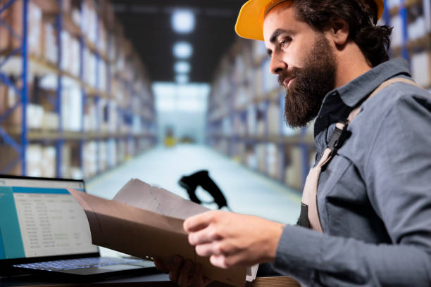 istock Depot engineer reviewing distribution contract details on files 1991935961