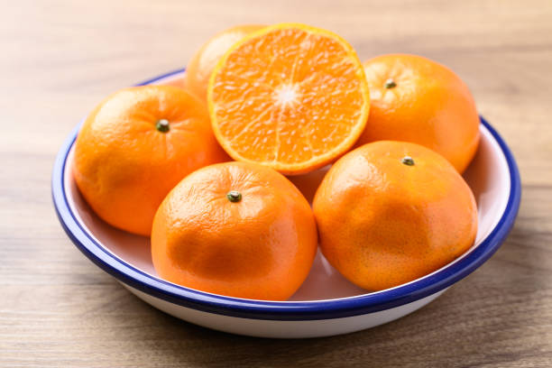 Mandarin orange fruit in bowl, Tropical fruit