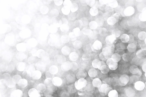 White and gray glitter sparkle shining light texture background. New Year, Christmas and celebration background concept.