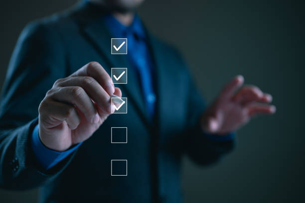 istock Business performance checklist, businessman using smartphone doing online checklist survey, filling out digital form checklist, take an assessment, questionnaire, evaluation, survey, online exam. 1991952774