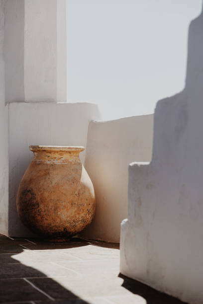 istock Pastel colored amphora on a sunny balcony on Sifnos island, Cyclades, Greece 1991955899