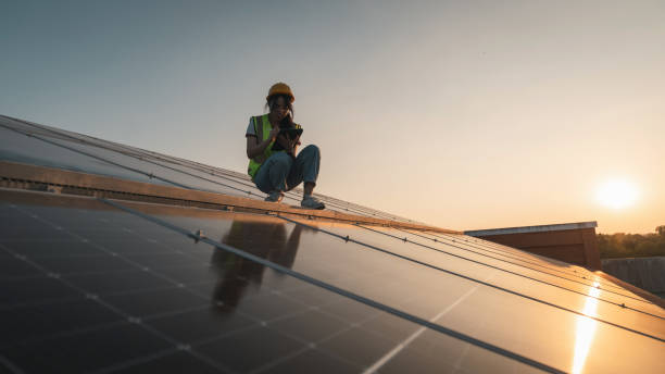 istock Service engineer checking solar cell on the roof for maintenance if there is a damaged part. Engineer worker install solar panel. Clean energy concept. 1991955910