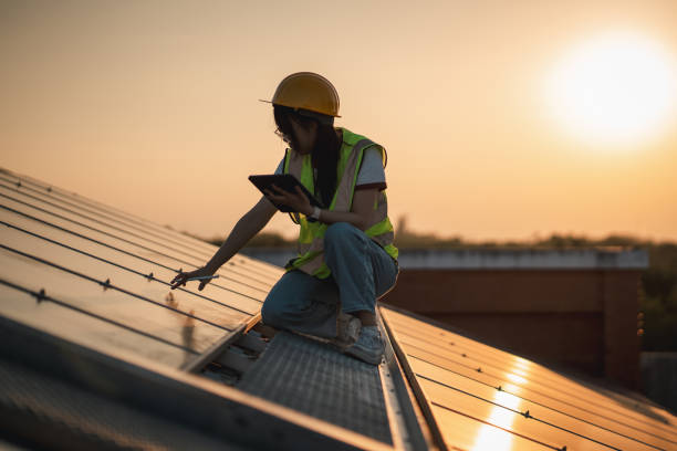 service engineer checking solar cell on the roof for maintenance if there is a damaged part. engineer worker install solar panel. clean energy concept. - fuel cell solar panel solar power station control panel fotografías e imágenes de stock