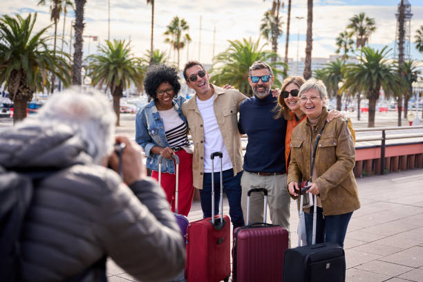 istock Group of middle-aged friends posing hugging looking happy at camera celebrating vacation picture. 1991972825