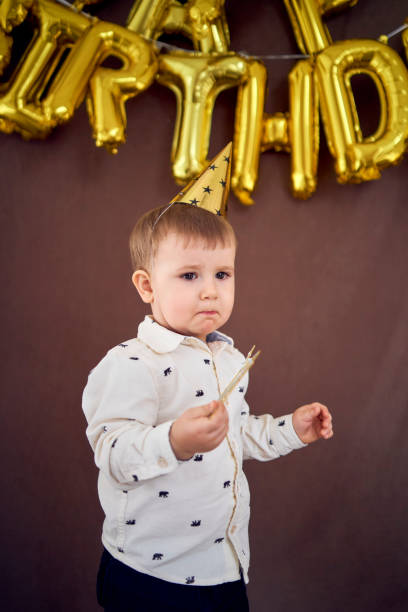 istock the little birthday boy eats his cake 1991976546