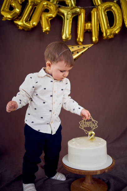 istock the little birthday boy eats his cake 1991976898