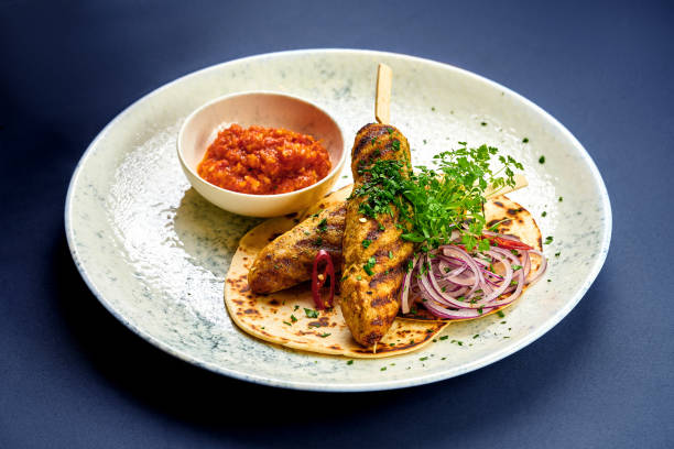 istock Turkish Lula kebab with pita bread and sauce in a plate 1991993913