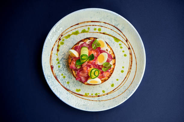 istock Toast with salmon and vegetables in a plate 1991993915