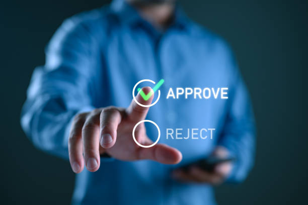 istock Approved, accept, pass inspection, Businessman writing or tick correct mark to approve document and project concept. Management, manager, examine, survey, tick, certification, business, technology. 1992010360