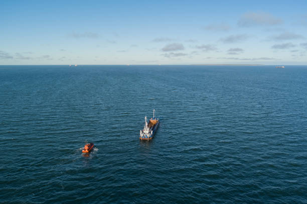istock The pilot's ship approaches the dry cargo ship. 1992014393