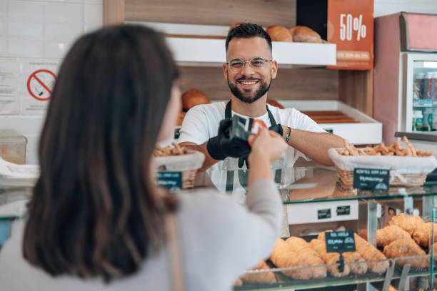 istock Seamless credit card transaction at the bakery counter 1992034990