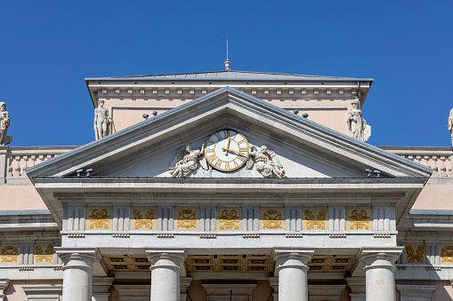 Trieste, Italy - September 26, 2023: Facade of historic Trieste Commodity Exchange located on Stock Exchange Square. It is one of the oldest commodity exchanges