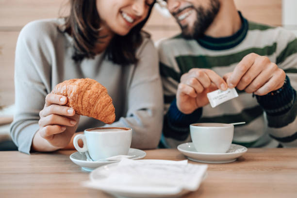 istock Couple's croissant and coffee time at the bakery 1992037746