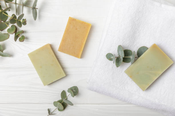 istock Soap on a texture background. Soap with eucalyptus extract and natural herbs on a white background. Beautiful Natural soap bars. Handmade organic soap concept. Skin care. banner 1992060379