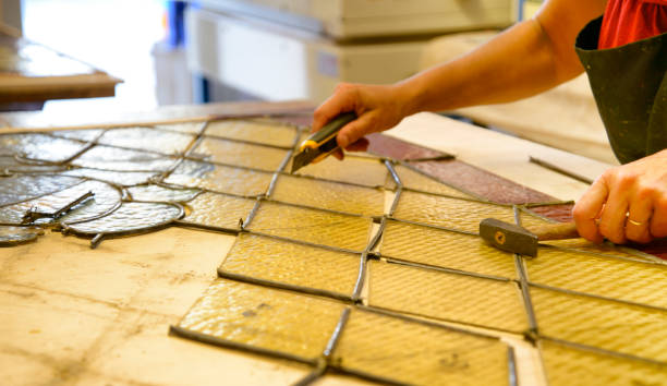 Restoring stained glass window.