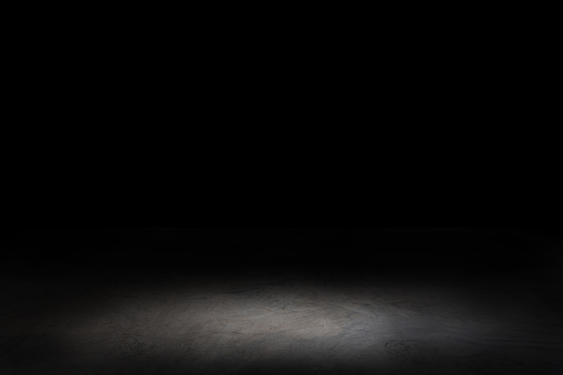 Dark room with cement, concrete floor. black wall cement  for product show with Elegant light background and texture. Abstract studio black room gradient background.