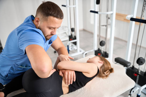 istock Chiropractor specialist working on young woman spine 1992122498