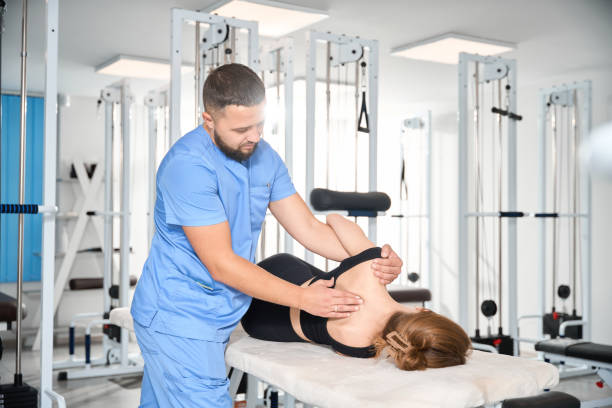 istock Chiropractor works with a patient in a rehabilitation center 1992123467