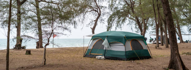 istock Camping in a tent on the beach by the sea 1992130444