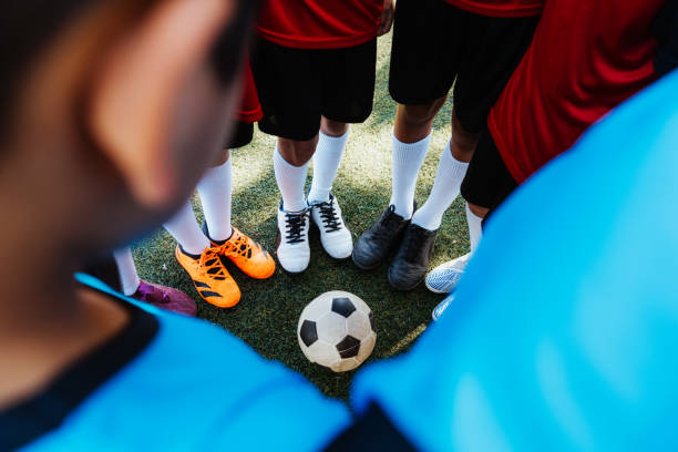 istock Young Soccer Players Standing Together on the Field 1992140442
