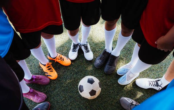 istock Young Soccer Players Team Huddle Before Match on Field 1992141503
